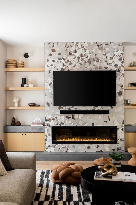 Terrazzo Living Room, Concrete Hearth, Layered Decor, Large Format Porcelain Tile, Oak Round Dining Table, Mid Century Fireplace, Black Cabinetry, Nook Design, Integrated Lighting