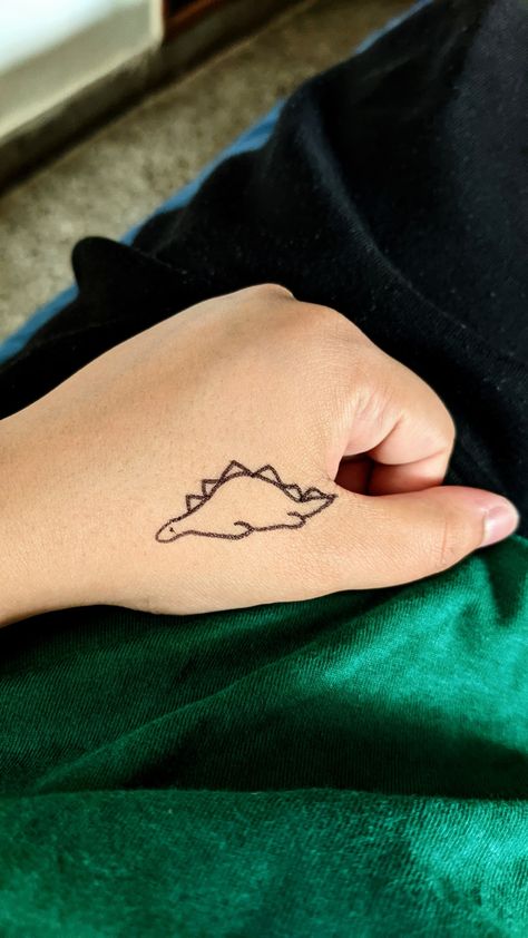 #tattoo #dinosaurtattoo #handtattoo #cutetattoo explore tattoo Sleeping Dinosaur Tattoo, Stegosaurus Tattoo, Sleeping Dinosaur, Wine Glass Tattoo, Dinosaur Tattoo, Dinosaur Tattoos, Dinosaur Drawing, Story Book, Infinity Tattoo