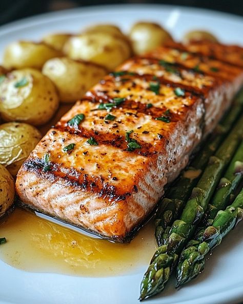 Savor the Flavors of Grilled Salmon with Roasted Potatoes and Cheesy Asparagus! 🍣🥔🧀 Ingredients: For the Grilled Salmon: • 4 salmon fillets • 2 tablespoons olive oil • Juice of 1 lemon • 2 cloves garlic, minced • 1 teaspoon dried dill • Salt and pepper to taste For the Roasted Potatoes: • 500 grams baby potatoes, halved • 2 tablespoons olive oil • 1 teaspoon paprika • 1 teaspoon garlic powder • Salt and pepper to taste For the Cheesy Asparagus: • 500 grams asparagus, trimmed • 1 tablespoon ol... Cooking Moodboard, Fall Party Food Ideas, Dill Salt, Cheesy Asparagus, Salmon Grilled, Fall Party Food, Dried Dill, Party Food Ideas, Evening Dinner