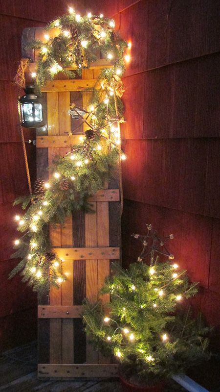 re-purposed my childhood toboggan with a garland of spruce cuttings and Christmas lights Outside Christmas Lights, Christmas Decorations On A Budget, Easy Outdoor Christmas Decorations, Christmas Lights Ideas, Garden Lighting Ideas, Decorations On A Budget, Outdoor Lighting Design, Diy Outdoor Lighting, Diy Christmas Lights