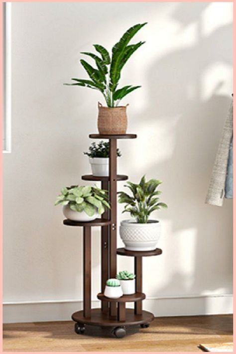 (paid link) Bring the Outdoors In with Unique Plant Arrangements and Green Ideas Wooden Flower Stand Design, Flower Stand Ideas Indoor, Tall Plant Stand, Tall Plant, Tall Plant Stands, Wood Folding Chair, Modern Plant Stand, Hanging Plant Wall, Wooden Plant Stands