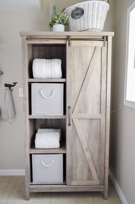 This girl made over her whole bathroom with things from Better Homes & Gardens at Walmart. I love this furniture piece. Can you believe she got this Farmhouse barn door storage cabinet there!? sponsored pin Ideas Armario, Farmhouse Bookcases, Makeover Kamar Mandi, Farmhouse Storage Cabinets, Bedroom Chairs, Child Bedroom, Small Space Bathroom, Diy Bathroom Storage, Wooden Bedroom