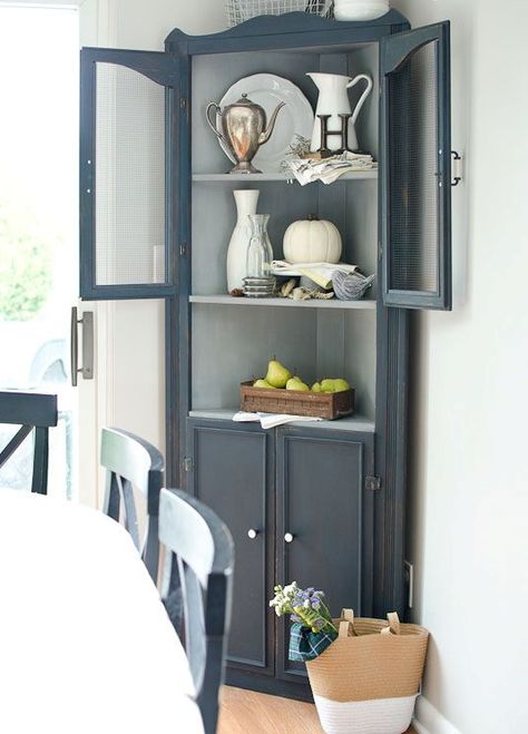 a graphite grey corner cabinet for storage and displaying any decorative objects Corner Cupboard Makeover, Corner Cupboard Decorating Ideas, Corner Cupboard Living Room, Corner Hutch Ideas, Corner Hutch Makeover, Corner Shelf Cabinet, Painted Corner Cabinet, Hutch Redo, Bedroom Furniture Redo