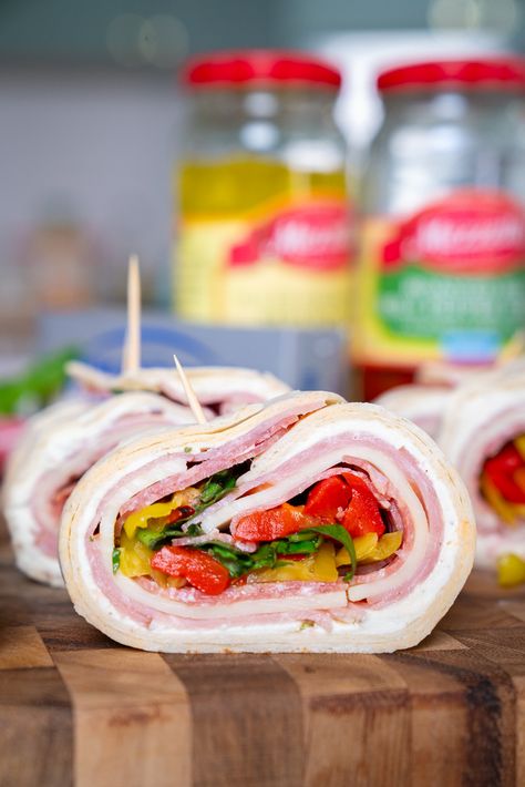 Italian Sub Bites | 12 Tomatoes Italian Sub Bites 12 Tomatoes, Italian Sub Bites, Italian Rolls, Sub Sandwich, Hosting A Party, 12 Tomatoes Recipes, Italian Sub, Popular Appetizers, Italian Deli