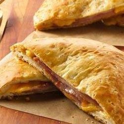 Grands!® Ham and Cheese Melts | "A flattened refrigerated biscuit is the perfect pairing for layers of deli ham and cheese in a hot sandwich that can't be beat." Ham And Cheese Melts, Grands Biscuits, Melt Recipe, Pillsbury Recipes, Cheese Pastry, Canned Biscuits, Biscuit Dough, Deli Ham, Hot Sandwich