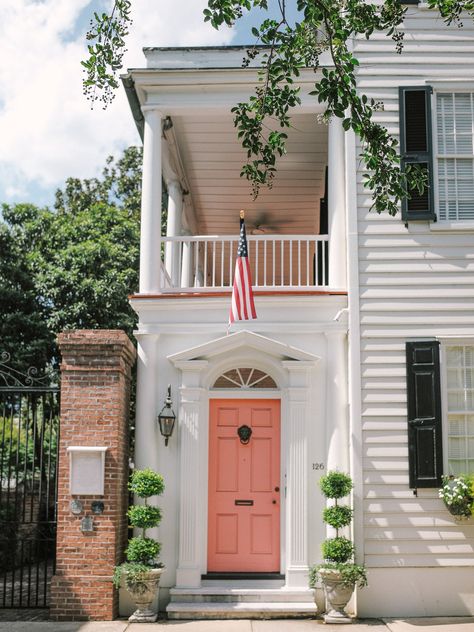 “Love this coral door. This doorway sums up the fun, sunny, but classic Charleston vibe.” Exterior Paint Combinations, Cottage Shutters, Window Shutters Exterior, Best Exterior Paint, House Paint Color Combination, Exterior House Paint Color Combinations, Exterior Stairs, Painted Cottage, Exterior Front Doors