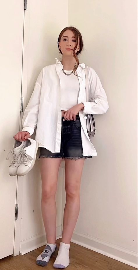 Casual Neutral Spring/Summer Outfit Inspo ft. a black & white outfit from my TikTok! This includes an oversized, white butron down blouse, silver chain necklace, white cropped tank top, black jeans shorts, small white bag, and whjte sneakers. All item details are in the link. Black Jeans Shorts, White Long Jacket, Outfit Kemeja, White Cropped Tank Top, White Summer Shirt, Oversized White Shirt, White Shirt Outfits, White Crop Tank, White Crop Top Tank