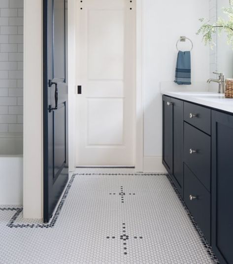 Bathroom with black and white sink vanity, white walls and door. Penny Round Tile Floor, Dark Eclectic, Bathroom Floor Tile Ideas, Floor Tile Ideas, Bathroom Floor Tile, Tile Backsplash Bathroom, Add A Bathroom, Penny Round Tiles, Eclectic Bathroom