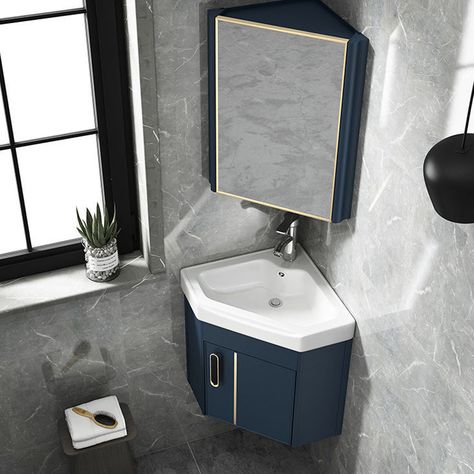 The wall-mounted vanity built with aluminum alloy and white China comes with a scratch and stain-resistant finish to give a sleek glazed look to your modern home, making it glide right in with your style. Our deep blue compact space-saving corner cabinet vanity sink is perfect for small bathrooms and powder rooms as it adds a touch of modernity to your space and it can perfectly meet your modern-day housing needs.- Overall Dimensions of Bathroom Vanity: 16.93"W x 16.93"D x 17.32"H (430mmW x 430mmD x 440mmH) vanity provides ample storage space.- Includes a large center cabinet with 1 door.- Ceramics vanity top includes an integral sink for easy cleaning.- Vanity top is pre-drilled for a 1.38“/35mm single hole faucet (faucet not included).- Smooth deep blue color is perfect for any modern ba Corner Sink Bathroom Small, Small Bathroom Sink Vanity, Lavabo D Angle, Corner Basin, Corner Bathroom Vanity, Corner Sink Bathroom, Corner Bathroom, Cabinet Vanity, Small Bathroom Sinks