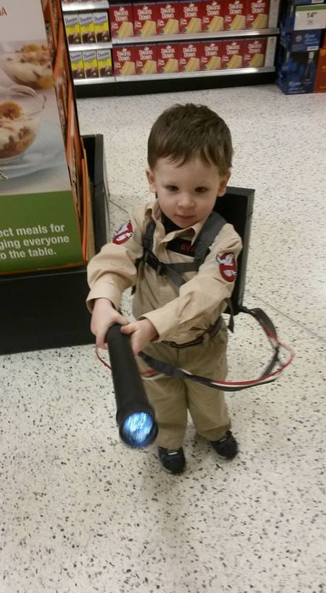 Ghost Buster Costume! A handmade proton pack with flashlight, a tan shirt (Amazon) with iron on patches from eBay and nametag from eBay. some tan pants and a belt make it look like a jump suit. Total $38 Toddler costume, toddler cosplay, ghostbuster Toddler Ghostbuster Costume, Ghost Buster Costume, Cupcake Halloween Costumes, Making Kids Clothes, How To Make Ghosts, Ghostbusters Theme, Ghostbusters Party, Ghostbusters Costume, Diy Ghost