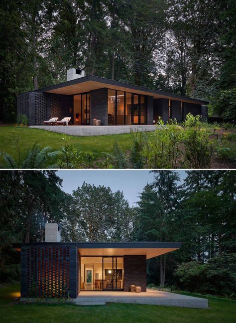 A Black Brick Exterior Is Consistent With The Dark Forest Surrounding This Modern Home Dark Brick Exterior, Black Brick Exterior, Modern Black Houses, Dark House Exterior, Dark Modern House, Stone Cabin, Black Brick Wall, Mid Century Exterior, House Pics