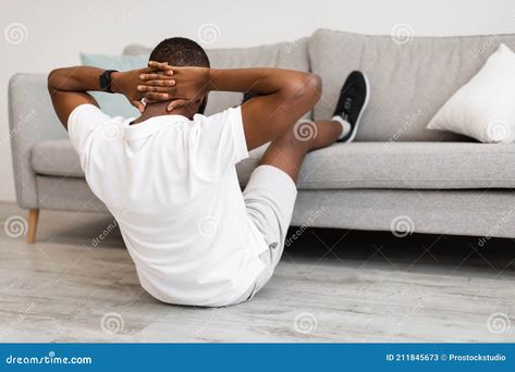 Workout At Home. Black Guy Doing Abs Crunches With Legs On Sofa Exercising Back To Camera In Living Room Indoors. Fitness Lifestyle And Sport Concept. Back-View Ab Crunch, Single Person, Fitness Lifestyle, At Home Workouts, Black Men, Lifestyle, Stock Images, Black