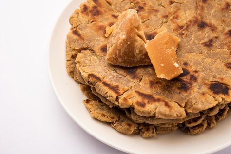 Sweet roti made out of rice flour, jaggery, and ghee. Gud ki roti. gur ki roti, jaggery Bhakri, meethi gud ki roti. Winter food. Copy space. Kurti Design, Rice Flour, Winter Food, Ghee, The Sweet, Making Out, Flour, Rice, For Free