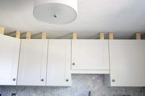 How to Install a Crown Molding to Kitchen Cabinets | JustAGirlAndHerBlog.com Kitchen Cabinet Crown Molding, Installing Kitchen Cabinets, Cabinet Molding, Cocina Diy, Crown Moldings, Ikea Cabinets, New Kitchen Cabinets, Kitchen Cabinets Makeover, Interior Painting