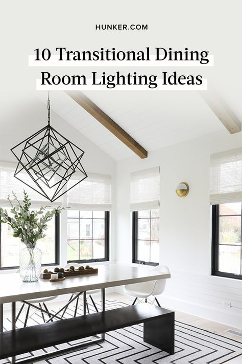 Want to bring the timeless aesthetic into your dining room? Transitional dining room lighting is the easiest — and often cheapest — way to do so. Below, 10 dining room lighting ideas that will illuminate your next dinner party. #hunkerhome #transitional #diningroom #lighting #lightingideas Slanted Ceiling Dining Room Lighting, Dining Room Light Fixtures Over Rectangle Table, Dining Table Ceiling Lights, Dining Room Table Lighting Fixture, Dinning Room Chandelier Modern Black, Large Dining Room Chandelier, Chandilers Dining Rooms, Transitional Modern Lighting, Black Modern Chandelier Dining Room