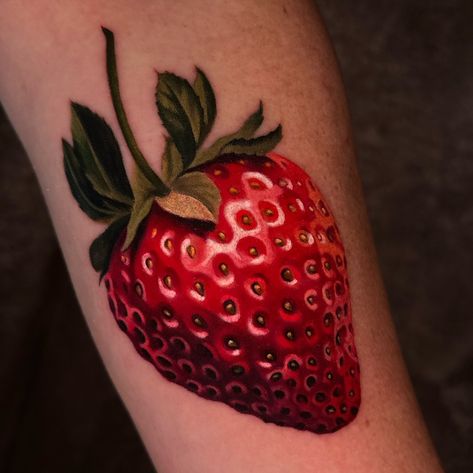 got to create this fun realistic strawberry tattoo for my client @lcordima yesterday and it was so dang fun🥰 swipe to check out my stencil 🫠 and another pic with some warmer lighting and don't forget to lemme know whatcha think🥰I always appreciate all of the comments and shares!!! you guys are the best! thanks Lisa! . @obsidianmoontattoo . @fusion_ink @neumatattoomachines @inkmapstattooapp Strawberry Tattoo, Fruit Tattoo, La Tattoo, Nyc Tattoo, Fusion Ink, Black And Grey Tattoos, Design Reference, Color Tattoo, Black Tattoos