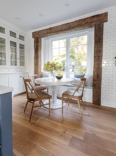 white kitchen with rustic beam and round breakfast nook table Dining Nooks, Rustic Beams, Nashville Apartment, Kitchen Remode, Lilypad Cottage, Kitchen 2022, Breakfast Nook Table, White Round Tables, Large Round Table