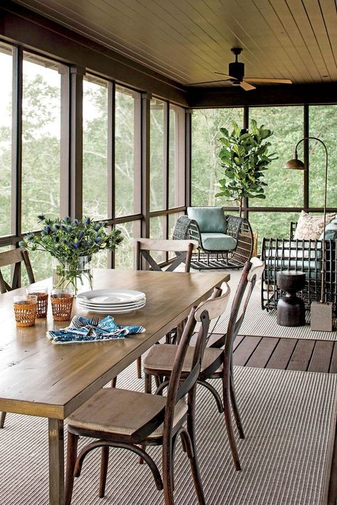 The Porch | Our former editor-in-chief shaped a tiny Southern Living house plan into a serene lakefront hideaway. Former Southern Living editor-in-chief Lindsay Bierman originally pictured a 2,500-square-foot, rustic-modern lake house rising from the rocks above Alabama's Lewis Smith Lake. He faced a tough choice: value-engineer the project to keep the quantity of space or downsize the plans to maintain the quality of space. If the home was built more true to size, around 1,000 square feet, he Porch Design Ideas, Screened Porch Designs, Balkon Decor, Southern Living House Plans, Modern Lake House, Building A Porch, Enclosed Porches, Sunroom Designs, Lots Of Windows