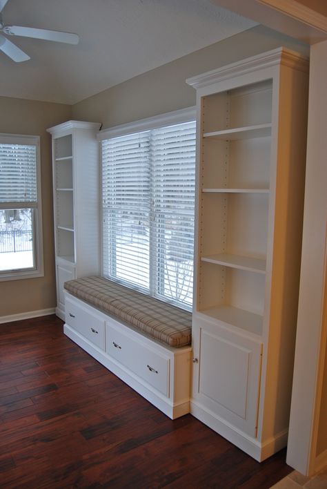 A custom designed and built 3 piece wall unit. A left and right bookcase, and a center window seat are shown.  Overall 133 3/4" long x 18 1/2" deep x 92" H max.   Wood: Brown Maple  Finish: SW 7006 Extra White tint. Project #1111410 Window Seat Ideas, Balcon Mic, Window Seat Design, Window Seat Storage, Bench Mudroom, Desain Furnitur Modern, Living Room Decor Inspiration, Bench Ideas, Bench Plans