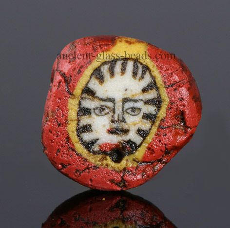 Roman mosaic glass face bead Ancient Egyptian Clothing, Ancient Mosaic, Egyptian Clothing, Ancient Beads, Glass Background, Mosaic Inlay, Face Carving, Roman Mosaic, 1st Century