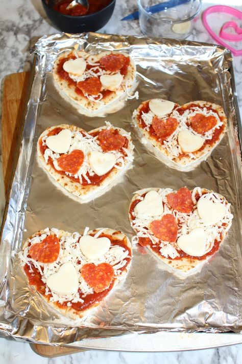 Heart Mini Pizza, Heart Shaped Lunch, Heart Shape Sandwiches, Mini Heart Shaped Pizza, Homemade Heart Shaped Pizza, Homemade Pizza Shapes, Love Heart Pizza, Mini Pizzas Recipe, How To Make Mini Pizzas