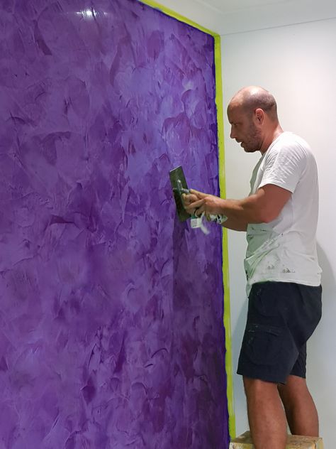 Purple feature wall in master bedroom with venetian polished plaster. Purple Feature Wall, Concrete Wall Design, Wall Paint Texture, Metallic Paint Walls, Mom Room, Stucco Paint, Hall Designs, Venetian Plaster Walls, Basement Lighting