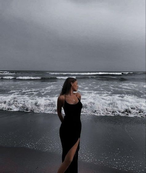 Dark Feminine Beach, Beach Poses Dress Outfit, Black Dress On Beach, Beach Poses In A Dress, Beach Photo Shoot Dress, Beach Photoshoot In Dress, Gloomy Beach Photoshoot, Beach Pictures Poses Instagram Dress, Black Dress Beach Photoshoot