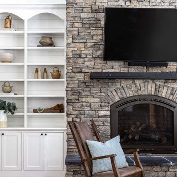 75 Family Room with a Stacked Stone Fireplace and a Wall-Mounted TV Ideas You'll Love - June, 2024 Outdoor Fireplace Stacked Stone, Stacked Stone Fireplace Makeover, Faux Stone Fireplaces, Stacked Stone Fireplace, Stone Fireplace Makeover, Poolhouse Bar, Color Layout, Tv Mounted, Stacked Stone Fireplaces