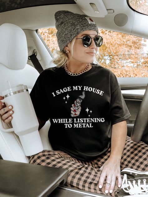 i sage my house while listening to metal, metalhead gifts, witchy sweatshirt, elder emo shirt CHOOSE YOUR PRODUCT: 1. Crewneck Sweatshirt in Black 2. Crewneck T-shirt in Black 🖤 SWEATSHIRTS INFO Printed on Gildan Unisex Sweatshirts! * 50% cotton, 50% polyester * Medium-heavy fabric (8.0 oz/yd² (271.25 g/m * Loose fit * Sewn-in label * Runs true to size * Without side seams 🖤 T-SHIRTS INFO Printed on Gildan Unisex Tshirts!  Up to 3XL printed on Gildan Softstyle, 4XL-5XL printed on Gildan Heavy Elder Emo Work Outfit, Elder Emo Aesthetic, Elder Emo Outfits, Emo House, Elder Emo Fashion, Emo Shirt, Witchy Outfits, Elder Emo, Emo Shirts