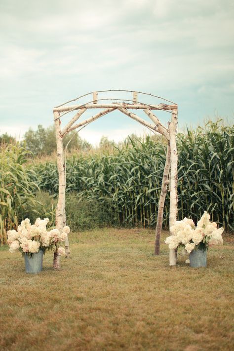 Simple, rustic arch juxtaposed with lush country-chic florals Corn Field Wedding, Country Wedding Arches, Cornfield Wedding, Rustic Arch, Yellow Wedding Decorations, Corn Field, Field Wedding, Yosemite Wedding, Pinterest Wedding