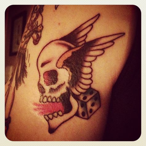 Winged Skull and Dice #BillyFerrier at #GraceTattoo #SailorJerry #TraditionalTattoos #Winged #Skull #Dice Winged Skull Tattoo Traditional, Skull With Wings Tattoo Traditional, Wings Traditional Tattoo, Skull With Wings Tattoo, Skull Tattoo Traditional, Grace Tattoo, Skull Dice, Skull With Wings, Grace Tattoos