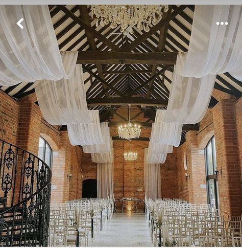 Wedding Ceiling Drapes And Lights, Rafter Decorations Wedding, Wedding Venue Ceiling Decor, White Drapery Wedding, Wedding Drapery Ideas Ceilings, Tulle Ceiling Draping, Wedding Draping Ceiling, Draping Fabric From Ceiling, Back Drops For Weddings Receptions