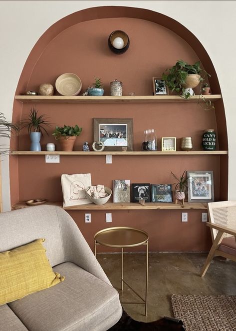 Arched Alcoves Living Room, Terra Cotta Bookshelf, Terracotta Bookshelf, Terracotta Bookcase, Arched Recessed Shelves, Arch In Wall Built Ins, Niche Bookshelves, Painted Alcoves, Living Room Niche Ideas