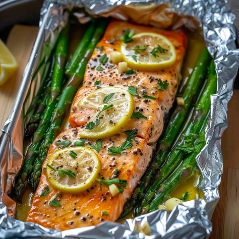 Baked Salmon in Foil with Asparagus and Garlic Lemon Butter Sauce Smoked Salmon And Asparagus, Salmon With Asparagus In Foil, Baked Salmon In Foil With Asparagus, Salmon Garlic Lemon Butter, Salmon And Asparagus Baked In Foil, Grill Salmon In Foil On Grill, Salmon Foil Packets Oven, Easy Salmon Recipes Baked, Salmon Asparagus Foil