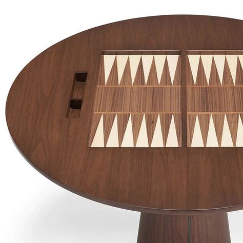 Quintus Home on Instagram: "MAGNUS GAME TABLE • This modern game table is extremely simple yet conceals (or should we say “reveals”) chess and backgammon boards. A starburst veneer removable top and inlaid details around the base add integrated eye catching design features. Available in standard Quintus wood finishes. #quintushome #table #gametable" Modern Game Tables, Backgammon Table, Backgammon Board, Wood Finishes, Game Table, Table Games, Chess, Wood Finish, Design Features