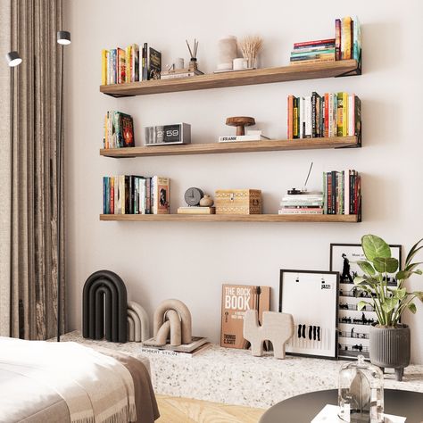 Get ready to transform your walls with Wallniture MINORI 60''x 6'' floating book shelf in burnt! This sleek, rustic beauty is not just a storage shelf; it's a statement piece. Perfect for showcasing your favorite books, plants, and decor, this hanging shelf adds a touch of warmth and character to any room. The rich burnt finish brings out the natural wood grain, making it a stylish yet functional addition to your home. Whether you're going for a modern, industrial, or farmhouse vibe, this wood s Book Shelves For Wall, Living Room Floating Bookshelves, Floating Shelves Master Bed, Bedroom Wall Bookshelves, Floating Office Shelves, Bedroom Shelves Aesthetic, Book Shelf Organizer Ideas, Large Empty Wall Ideas Bedrooms, Whole Wall Shelves