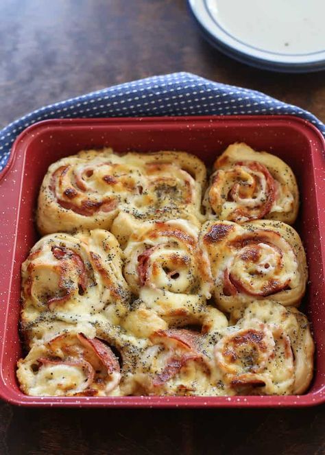 These ham and cheese rolls are layered with savory ham, filled with melty cheese, and covered in a mouthwatering, tangy honey and Dijon mustard glaze. Using store-bought pizza dough is the time-saving trick that makes this recipe quick and easy. #easyrecipe #easydinner #gameday #party #potluck #sandwich Baked Ham And Cheese Rolls, Ham And Rice Casserole, Ham And Cheese Rolls, Ham Cheese Rolls, Bun Recipes, Easy Easter Recipes, Honey Mustard Glaze, Cheese Rolls, Cheese Buns