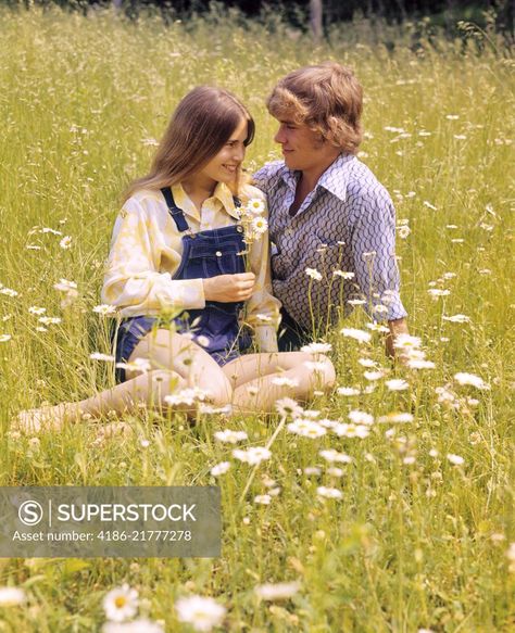 1970s Romantic Teenage Couple Sitting In A Field Of Daisies Sitting In Flower Field Reference, Couple Sitting Together Reference, Couple Sitting Together Pose Reference, Couple Sitting Reference, Couple Sitting Poses Reference, Sitting In A Flower Field, 1970s Couple, Sitting Couple Poses, Couple Sitting Poses