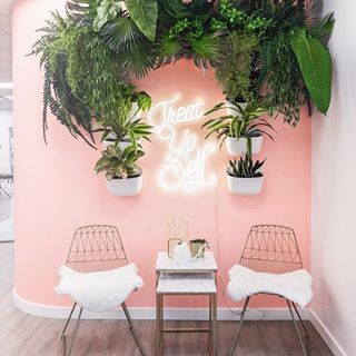 Image may contain: people sitting, plant, table and indoor Vertical Garden Wall Planter, Garden Wall Planter, Esthetician Room Decor, Esthetics Room, Spa Room Decor, Salon Suites Decor, Esthetician Room, Nail Salon Decor, Vertical Garden Wall