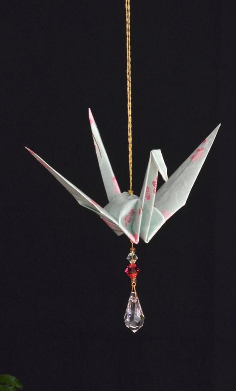 "Very unique, decorative accent symbolizing peace, hope and good fortune. These handcrafted suncatchers are made from Japanese paper, and are perfect for gift giving.  In Japan, it is fabled that the crane has a life span of one thousand years. Known to mate for life, the crane has long been regarded as a symbol of fidelity, longevity and good fortune. In modern days, the origami crane is also a popular symbol of peace and hope.  My origami crane suncatchers are designed to evoke a sense of calm Japanese Diy Decorations, Origami Crane Mobile, Paper Crane Decor, Origami Aesthetic, Paper Crane Mobile, Origami Japanese, Crane Mobile, Origami Mobile, Origami Artist