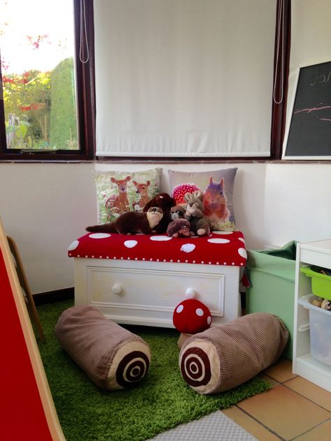 Children's playroom, woodland theme, indoor slide, DIY log cushions, toadstool seat, toy storage, light and bright, DIY play kitchen, Ikea rug Diy Nature Nursery Decor, Cottage Core Themed Nursery, Forestcore Nursery, Woodland Furniture, Woodland Theme Playroom, Fairy Playroom, Woodland Room Aesthetic, Woodland Themed Room, Gnome Bedroom