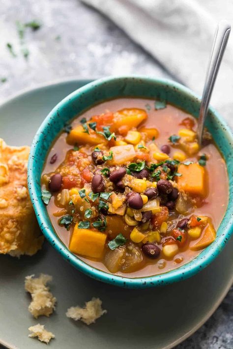 Black bean, quinoa and sweet potato stew in blue bowl with a chunk of bread next to it Plant Based Slow Cooker Recipes, Plant Based Slow Cooker, Slow Cook Vegetarian, Sweet Potato Stew, Bean Quinoa, Vegan Slow Cooker Recipes, Vegan Crockpot Recipes, Slow Cooker Black Beans, Vegetarian Slow Cooker Recipes