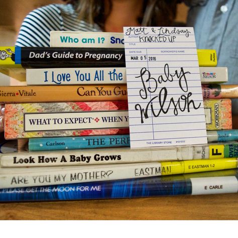 Cute Library Themed Pregnancy Announcement #pregnancyannouncement Book Themed Pregnancy Announcement, Bookish Pregnancy Announcement, Bookish Baby Announcement, Book Baby Announcement, Book Pregnancy Announcement, Literary Nursery, Nerdy Nursery, Pregnancy Date, Husband Pregnancy Reveal