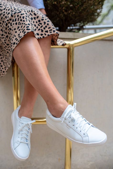 Fashion blogger Bows & Sequins styling the Keds White Leather Ace Sneakers with a leopard skirt. Sneakers With Skirts, Leather Shoes Outfit, Keds White Sneakers, Leather Sneakers Outfit, Keds Outfit, White Leather Tennis Shoes, Feminine Skirts, White Leather Dress, Leather Keds