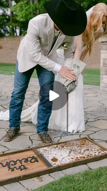 Alyson Jean Weddings & Events on Instagram: "You set my world on fire 🔥  POV: You have a unity branding ceremony at your wedding 🐄   Board by: @brittany.thecopperpony   Planner: @alysonjean_events Venue: @pavilion_at_carriage_farm Florist: @brushedbybec.florals Rentals: @curatedeventsraleigh Catering: @cookshackcatering Cake: @lbscakes_ DJ: @impultzdjs Photo: @pattybettsphoto Transportation: @lwtwhitehorse @lifestyle_limousine HMU: @blushedbridalnc Bride: @tayylorbaker_ Groom: @natereichel Bride’s Dress: @carolinabridalworldtriangle Bridesmaid Dress: @birdygrey Menswear: @josabank Hat: @twisterhats @roughstockwestern  Boots: @tonylamaboots  Jewelry: @shanecompany Website: @zola" Unity Branding Ceremony, Branding Ceremony Wedding, Branding Ceremony, Nate Smith, Jeans Wedding, Wedding Unity, Wedding Boots, World On Fire, Wedding Branding