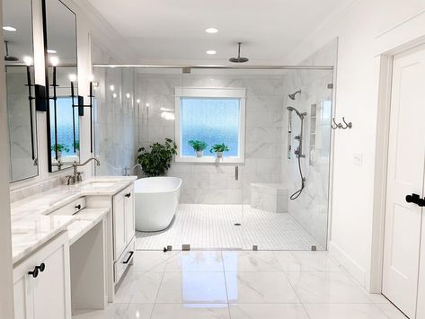 This wet room with white and gray marble tiled walls features a white freestanding tub next to shower behind a glass enclosure. A nickel built-in corner shower bench sits on white grid floor tiles. Tub Next To Shower Ideas, White Subway Tile Shower, Half Wall Shower, Tile Shower Niche, Marble Shower Tile, Brick Shelves, White Tile Shower, Subway Tile Showers, Bathroom With Tub