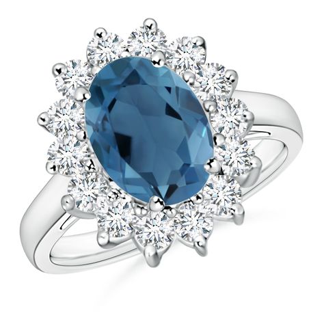 The design of this fascinating London blue topaz ring is inspired by Princess Diana's beautiful engagement ring. An oval prong set London blue topaz sits majestically at the core of a floral halo of diamonds. The diamonds enhance the beauty of the greenish blue gemstone. Sculpted in 14k white gold, this London blue topaz ring with diamond halo bespeaks royalty and glamour. Blue Topaz Halo Ring, Floral Halo, Bezel Set Ring, London Blue Topaz Ring, Ring With Diamond, Greenish Blue, Beautiful Engagement Rings, Blue Gemstones, London Blue Topaz