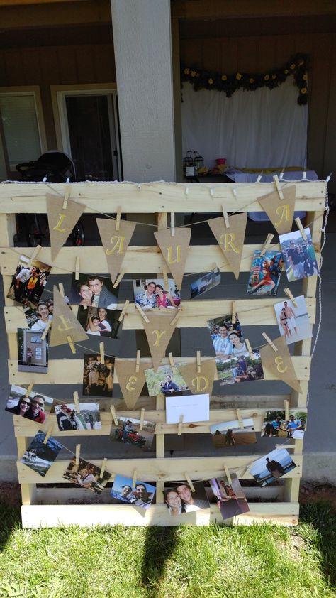 One of my bridesmaids made a simple pallet picture display with white Christmas lights Wood Pallet Picture Display, Pallet Picture Display, Senior Table, Bbq Decorations, Saddle Club, Pallet Pictures, Christmas Lights Outside, White Christmas Lights, Hanging Christmas Lights