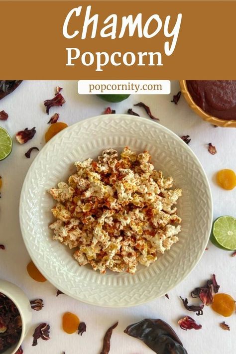 bowl of chamoy popcorn with apricots, lime, hibiscus and chili peppers. Tajin Popcorn, Infused Popcorn Recipe, Sweet And Spicy Popcorn Recipes, Chamoy Rim Dip Drinks, Cinnamon Candy Popcorn, Popcorn Recipes Savory, Sugar Popcorn, Savory Popcorn, Stovetop Popcorn