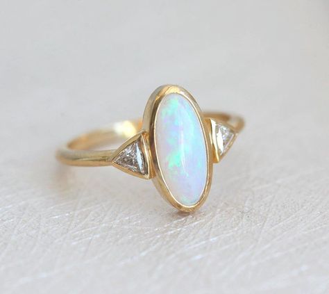 Best seller at Capucinne - Gorgeous one of a kind Australian oval opal & diamond ring perfect as a wedding or engagement ring. Available in 18k yellow gold as seen online. If you would like to have other gemstones instead of diamonds/opals Luxury Classic Opal Ring With Center Stone, Gold Wrap Ring, Diamond Half Eternity Band, Australian Opal Ring, Opal Diamond Ring, Ring Inspo, Opal Engagement, Engagement Rings Opal, Morganite Engagement Ring